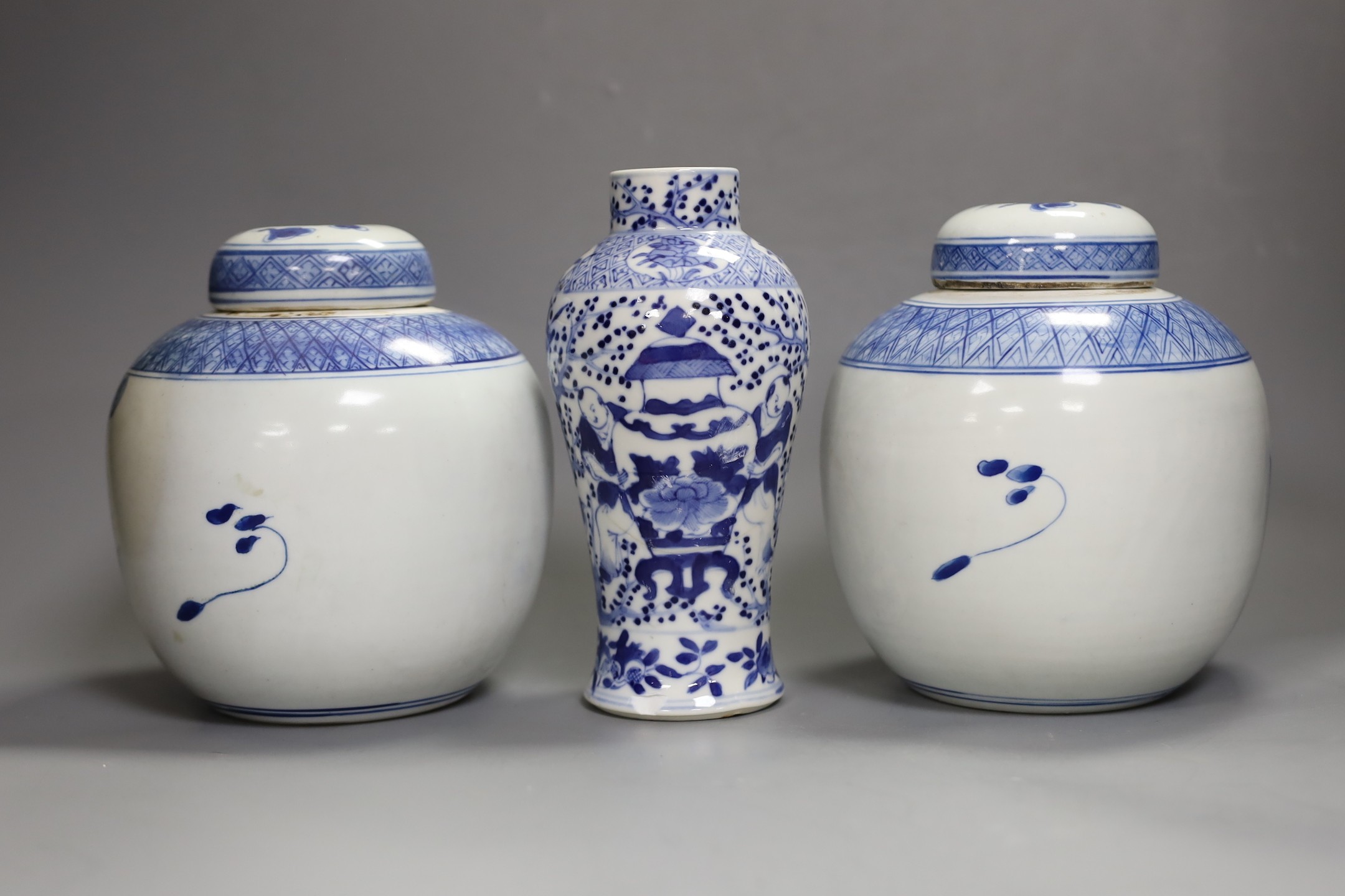 A 19th century Chinese blue and white vase (a.f) and two later jars and covers, tallest 19cm